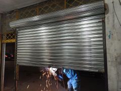 Motorised Iron Rolling Shutter Height 15 Feet Slat Type Plain Usage Area Godown Operation Motorized Material Mild Steel Shutter Thickness 0.8 - Image 1