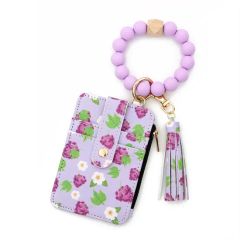 Stylish Leather Tassel Flower Keychain and Silicone Bead Bracelet - Image 3