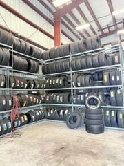 Wholesale Warehouse Used & New Auto Tires Lot – Racked Assorted Sizes - Image 1