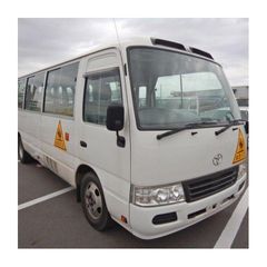 Toyota Coaster bus with strong body design and advanced safety features Toyota Coaster vehicle for public transport and private hire services Toyota Coaster high roof bus for maximum passenger capacity Toyota Coaster minibus with manual and automatic transmission options - Image 1