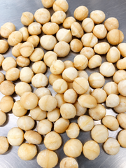 Premium Kenyan macadamia kernels available in Styles 0–8, including wholes, halves and pieces, graded and export-packed - Image 1