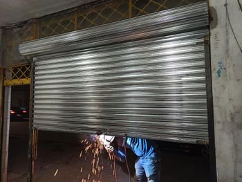 Motorised Iron Rolling Shutter Height 15 Feet Slat Type Plain Usage Area Godown Operation Motorized Material Mild Steel Shutter Thickness 0.8 - Toobi Metals - India