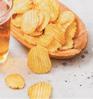 Fried big wave potato chips snack in bulk.Potato Chips French fries puffed food Production Line Potato Chips - Almaa SCS - Belgium