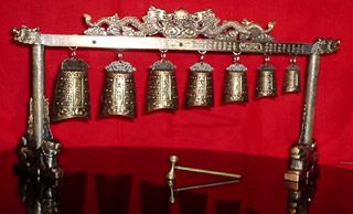 Tibetan Bells Material Metal Finish Antique Product Form Bells Design Feature Hanging From Metal Stand Elevated On Lions With - Dinesh Flour Mills - India
