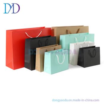 Custom Printed Production Your Own Logo Cardboard Packaging White Brown Kraft Gift Craft Shopping Paper Bag with Handles - DONGYAODA (XIAMEN) TRADING CO., LTD. - China