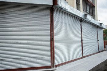 Motorised Rolling Shutter Material Mild Steel Wall Thickness 6 mm Length Approx. 14 Feet Usage/Application Shop Height Approx. 12 - Cosmos Construction Machineries And Equipments Private Limited - India