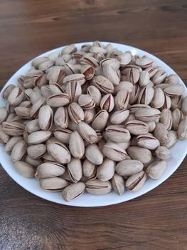 persian pistachio(Akbari Pistachio) Yield High Grade 18-22 Packaging pp bags Flavor Full, Rich Type AKBARI Pistachio Shape Large, Elongated - Arya Exim - Iran