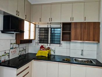 L Shaped Modular Kitchen Durability High Aesthetics Modern Layout Smart Layouts Cabinet Material MDF Warranty Up to 10 - Anugraha Home Interiors And Constructions - India