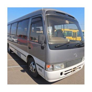Toyota Coaster minibus for long distance travel and group transportation Toyota Coaster bus with strong body design and advanced safety features Toyota Coaster vehicle for public transport and private hire services Toyota Coaster high roof bus for maximum passenger capacity - SATTER FOOD AND BEVERAGE - Netherlands