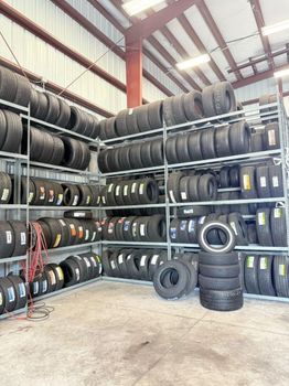 Wholesale Warehouse Used & New Auto Tires Lot – Racked Assorted Sizes - Summit Industrial LLC - United States
