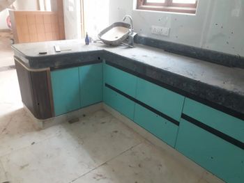 L Shaped Modular Kitchen Material Wooden Appearance Modern Kitchen Design - RD Construction - India