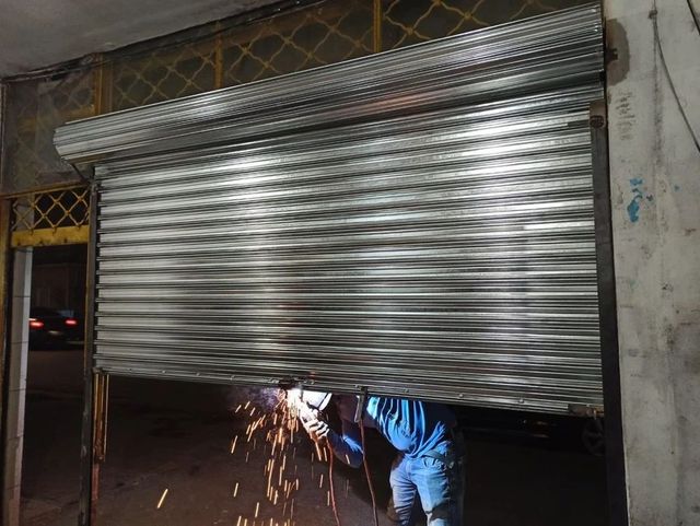 Motorised Iron Rolling Shutter Height 15 Feet Slat Type Plain Usage Area Godown Operation Motorized Material Mild Steel Shutter Thickness 0.8 - Image 1