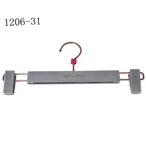 New Design Velvet Plastic Bottom Pants Hangers MOQ 3000PCS Trademark YY Origin China Model NO. 1206 Logo Customized Hook - Image 1