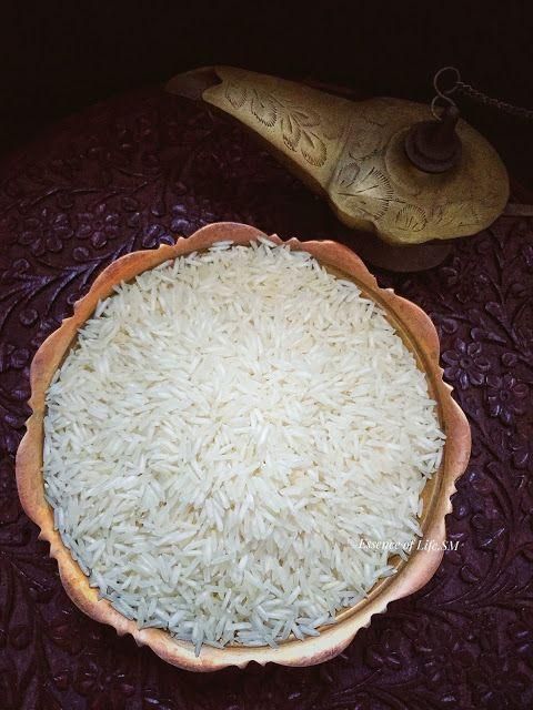 White Rice Grains in Wooden Spoon for Cooking and Baking - Image 2