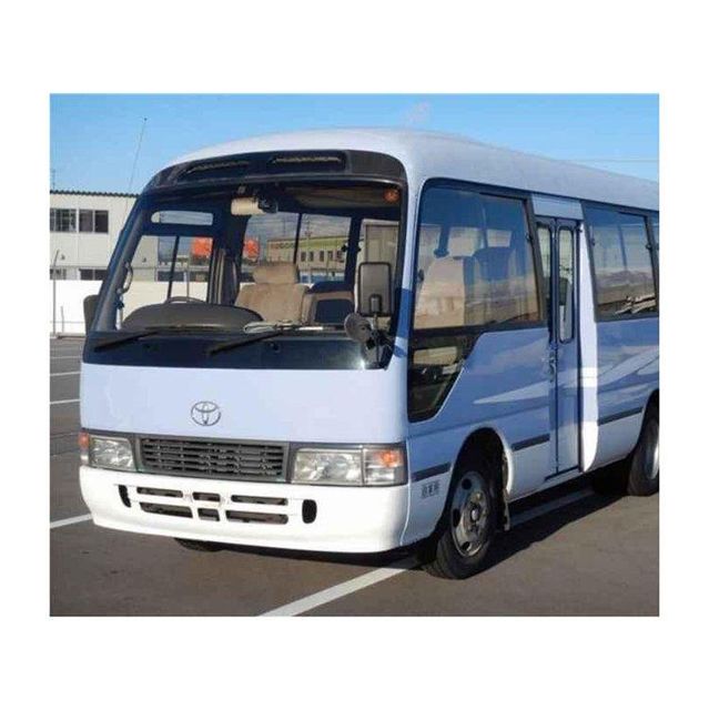 Toyota Coaster vehicle for public transport and private hire services Toyota Coaster high roof bus for maximum passenger capacity Toyota Coaster minibus with manual and automatic transmission options Toyota Coaster reliable bus with low maintenance cost and durability - Image 2