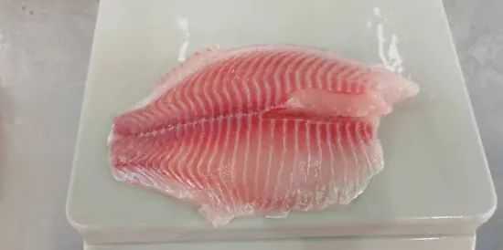 Frozen Tilapia Fillet Fish Sea Food Origin China HS Code 030323 Processing IQF Style Pieces and Stems Model NO. Frozen - Image 2