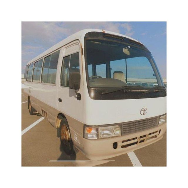 Toyota Coaster high roof bus for maximum passenger capacity Toyota Coaster minibus with manual and automatic transmission options Toyota Coaster reliable bus with low maintenance cost and durability Toyota Coaster bus suitable for urban and rural transportation - Image 3