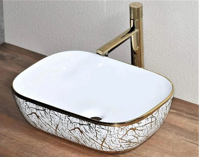 Ceramic Wash Basin Color White Finish Glossy Shape Rectangular Design Type Simple Design Feature Sleek Surface Texture - Image 1