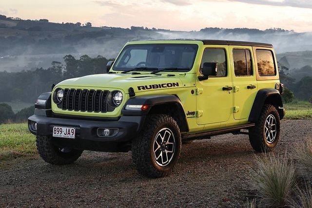 Jeep Wrangler rugged off road vehicle with strong 4WD system powerful engine high suspension travel durable build removable doors and roof perfect SUV for adventure lovers trail driving and extreme terrain exploration - Image 4